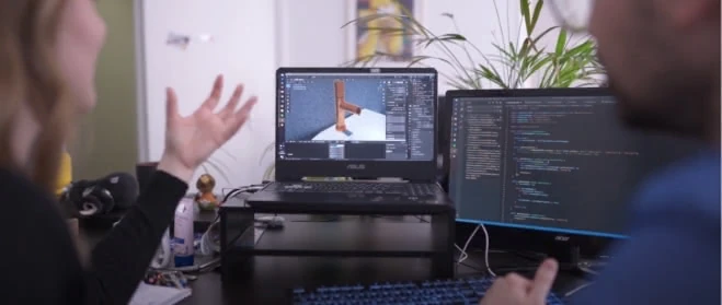 Image d'un modélisateur 3D et d'un morceau de code